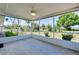 A large screened porch offers tile floors and views of the spacious backyard at 20430 Edgewater Dr, Port Charlotte, FL 33952