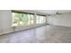 Sunroom boasting large windows and tile flooring, perfect for relaxation at 20430 Edgewater Dr, Port Charlotte, FL 33952