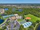 Aerial view of community amenities, including tennis courts, clubhouse, and sports fields at 2146 Snapdragon Ln, Venice, FL 34292