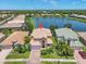 Aerial view of the home and the beautiful lake behind the house at 2146 Snapdragon Ln, Venice, FL 34292