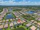 Wide aerial shot exhibiting the density of a residential area, boasting multiple ponds and established landscaping at 2146 Snapdragon Ln, Venice, FL 34292