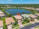 Aerial view of the home and the beautiful lake behind the house at 2146 Snapdragon Ln, Venice, FL 34292