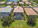 An aerial perspective of a home’s backyard with a screened pool and well-maintained lawn enclosed within property lines at 2146 Snapdragon Ln, Venice, FL 34292