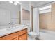 Bathroom featuring a well-lit vanity, ample storage, and shower-tub combination at 2146 Snapdragon Ln, Venice, FL 34292