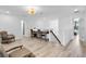 Upstairs loft area featuring a built-in desk, seating area, and natural light at 2146 Snapdragon Ln, Venice, FL 34292