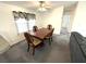 Cozy dining room with traditional wood table and decorative chairs at 217 Blackburn Blvd, North Port, FL 34287
