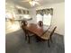 Dining room boasts wood table and decorative chairs at 217 Blackburn Blvd, North Port, FL 34287