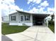 Lovely single-story home with a convenient carport and concrete driveway at 217 Blackburn Blvd, North Port, FL 34287