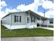Charming single-story home featuring a carport and well-maintained lawn at 217 Blackburn Blvd, North Port, FL 34287