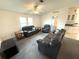 Cozy living room with carpet, vaulted ceiling, and ceiling fan at 217 Blackburn Blvd, North Port, FL 34287