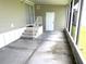 Porch featuring a door, stairs, and screens at 217 Blackburn Blvd, North Port, FL 34287