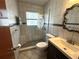 Modern bathroom with a glass-enclosed shower, unique tile accents, and a stylish vanity at 232 Fiesole St, Venice, FL 34285