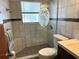 Stylish bathroom with a glass-enclosed shower, decorative tile work, and contemporary vanity at 232 Fiesole St, Venice, FL 34285
