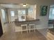 Cozy dining area with bar access, adjacent to living spaces and plenty of natural light at 232 Fiesole St, Venice, FL 34285