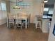 Charming dining area featuring a rustic table set with a decorative light fixture above it at 232 Fiesole St, Venice, FL 34285