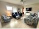 Cozy living room with modern furnishings, plenty of seating, and natural light at 232 Fiesole St, Venice, FL 34285