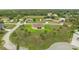 Aerial view showcases the home's spacious lot and landscaping in a quiet neighborhood surrounded by natural beauty at 2479 Grandview Dr, North Port, FL 34288