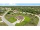Desirable home on a large lot, showcasing lush greenery, mature trees, and convenient access to nearby amenities at 2479 Grandview Dr, North Port, FL 34288