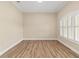 Bright bedroom with hardwood floors, crown molding, and plantation shutters at 2479 Grandview Dr, North Port, FL 34288