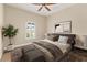 Warm bedroom boasts a plush bed, soft lighting, and tasteful decor, perfect for relaxing and unwinding at 2479 Grandview Dr, North Port, FL 34288