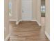 Inviting foyer with beautiful wood-look tile flooring and a view to the front door at 2479 Grandview Dr, North Port, FL 34288