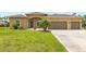 Well maintained single-Gathering home with manicured lawn and two car garage in a residential neighborhood at 2479 Grandview Dr, North Port, FL 34288
