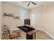 Bright office space features sleek desk setup, modern shelving, and stylish decor for a productive work environment at 2479 Grandview Dr, North Port, FL 34288