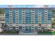 Exterior view of beach condos with a swimming pool and ocean views at 255 The Esplanade N # 106, Venice, FL 34285