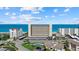Stunning beachfront condo building with ocean views and manicured landscaping at 255 The Esplanade N # 106, Venice, FL 34285