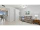 Bright living room featuring a sofa, throw pillows, and tile flooring at 255 The Esplanade N # 106, Venice, FL 34285