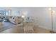Cozy living space adjacent to the dining area, filled with natural light and comfortable seating at 255 The Esplanade N # 106, Venice, FL 34285