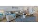 Inviting living room with an ocean view, comfortable sofa, and stylish decor at 255 The Esplanade N # 106, Venice, FL 34285