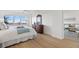 Serene main bedroom with ocean views and a dresser with a decorative mirror at 255 The Esplanade N # 106, Venice, FL 34285