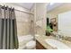Functional bathroom featuring a shower-tub combo, granite counters, and vanity offers a clean and practical space at 2944 Oriole Dr, Sarasota, FL 34243