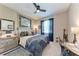 Comfortable bedroom features neutral walls, a ceiling fan, and patterned bedding creating a relaxing and inviting atmosphere at 2944 Oriole Dr, Sarasota, FL 34243
