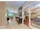 Hallway leads to the home office and the living room featuring access to the backyard at 2944 Oriole Dr, Sarasota, FL 34243