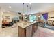 Open concept kitchen with stainless steel appliances and a great view of the connected living space at 2944 Oriole Dr, Sarasota, FL 34243