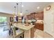 Well-lit kitchen with granite countertops, stainless steel appliances, and an adjacent dining area at 2944 Oriole Dr, Sarasota, FL 34243