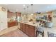 Bright open kitchen with granite countertops, stainless steel appliances, and kitchen island at 2944 Oriole Dr, Sarasota, FL 34243