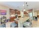 An open kitchen design with granite countertops, stainless steel appliances, and a central kitchen island at 2944 Oriole Dr, Sarasota, FL 34243