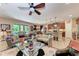 Spacious living area with a ceiling fan, a modern kitchen, and an open floor plan at 2944 Oriole Dr, Sarasota, FL 34243