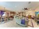 Open-concept living area with a ceiling fan, seamlessly connecting to the kitchen and dining spaces at 2944 Oriole Dr, Sarasota, FL 34243