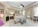 Serene main bedroom with tray ceilings, neutral color scheme, and cozy seating area at 2944 Oriole Dr, Sarasota, FL 34243