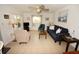 Comfortable living room with tile floors, ceiling fan and screened porch access at 320 Base E Ave # 215, Venice, FL 34285