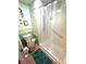 Bathroom with toilet, shower, and green accents at 344 Mariner Dr, North Port, FL 34287