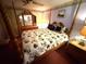 Comfortable bedroom featuring four-poster bed, floral accents, and plenty of natural light at 344 Mariner Dr, North Port, FL 34287