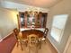 Formal dining area with wood table, china cabinet, and chandelier at 344 Mariner Dr, North Port, FL 34287