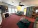 Comfortable living room with a fireplace, plush seating, and plenty of natural light at 344 Mariner Dr, North Port, FL 34287