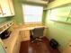 Cozy office space featuring built-in desk, cabinets, and shelving, perfect for a home office or study at 344 Mariner Dr, North Port, FL 34287