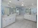 Elegant bathroom with a soaking tub, dual sinks, and updated fixtures for a modern feel at 346 Roseling Cir, Venice, FL 34293